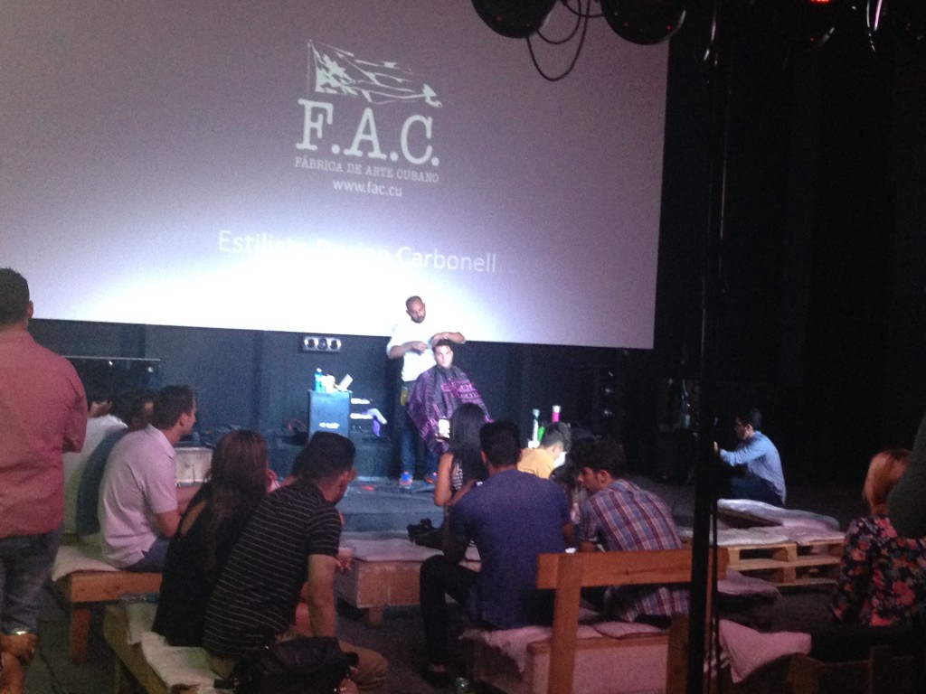 This is an audience watching a guy get his hair cut in one of the rooms at La Fabrica. Shoreditch eat your heart out.